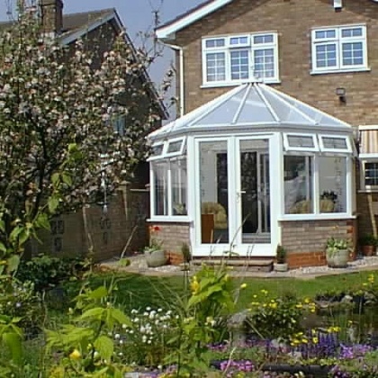 White uPVC outdoor conservatory in the garden