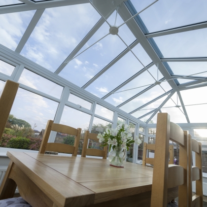 Sun shining through a glass roofed conservatory