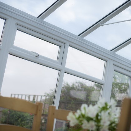 Sun shining through a glass conservatory window