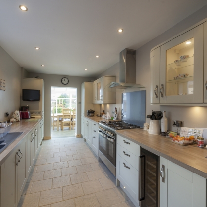 Looking through a kitchen into a conservatory