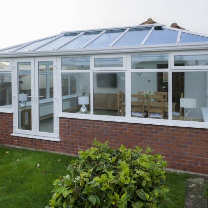 Outside view of a conservatory with rainy outdoors