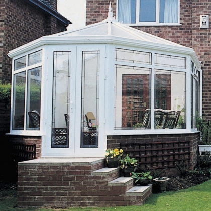 uPVC Glazed extension with steps and flowers