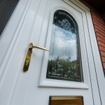 Close up uPVC door with Brass handle and letter box