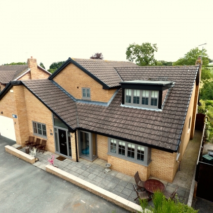 House with PVCu Flush sash bay windows