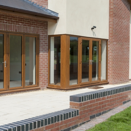 Woodgrain uPVC french doors outside