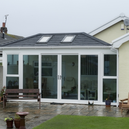 Outside view of a conservatory with rainy outdoors