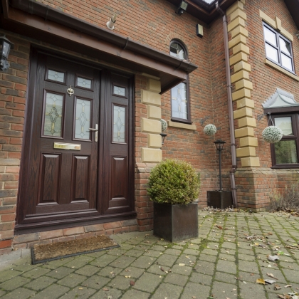 Brick house with brown composite doors