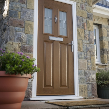 Dual windows composite door with silver knocker and letterbox