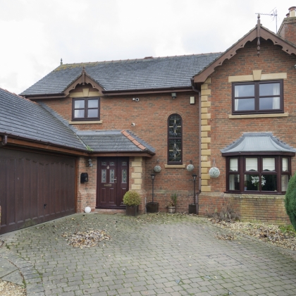 House with rosewood windows and doors