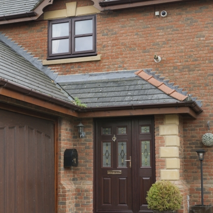 Brick house with wood texture composite door