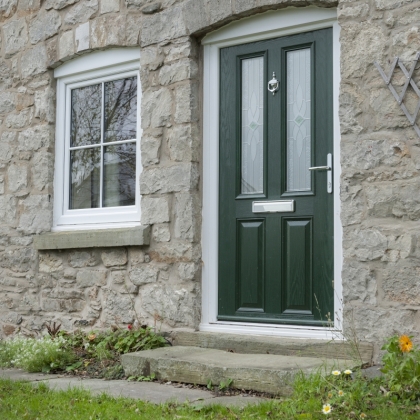 Green Composite door with white uPVC window