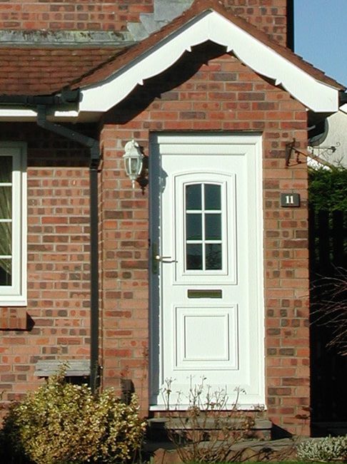 Image of house with white PVCu windows and PVCu door